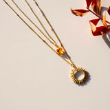 Vinoos COLOURS OF WINE Dubbele ketting met zon en amber glaskraal, Inner glow
