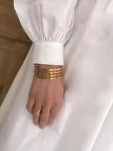 Ellen Beekmans Brede bangle armband met 4 open cirkels